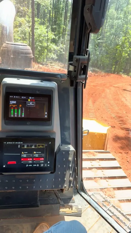 View from the dozer cab as the grading crew finishes a new road